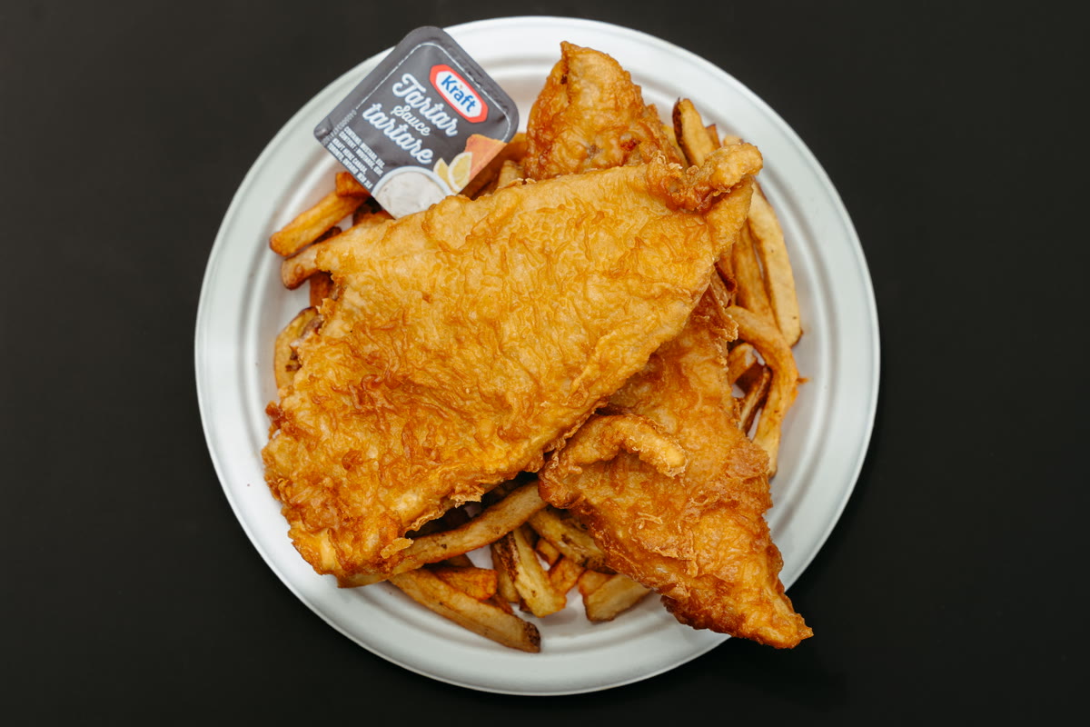 A plate of Bud the Spud fish and chips with tartar sauce
